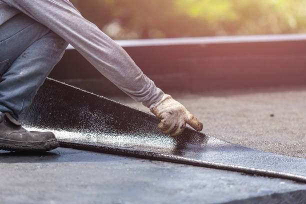Professional Waterproofing technician working in Grand Blanc, MI